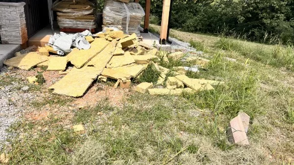 Truck bed loaded with hauled-away junk